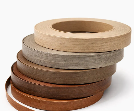 Stacked ABS edge banding rolls with wood grain finishes