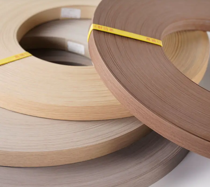 Close up of PVC edge banding rolls with wood grain texture